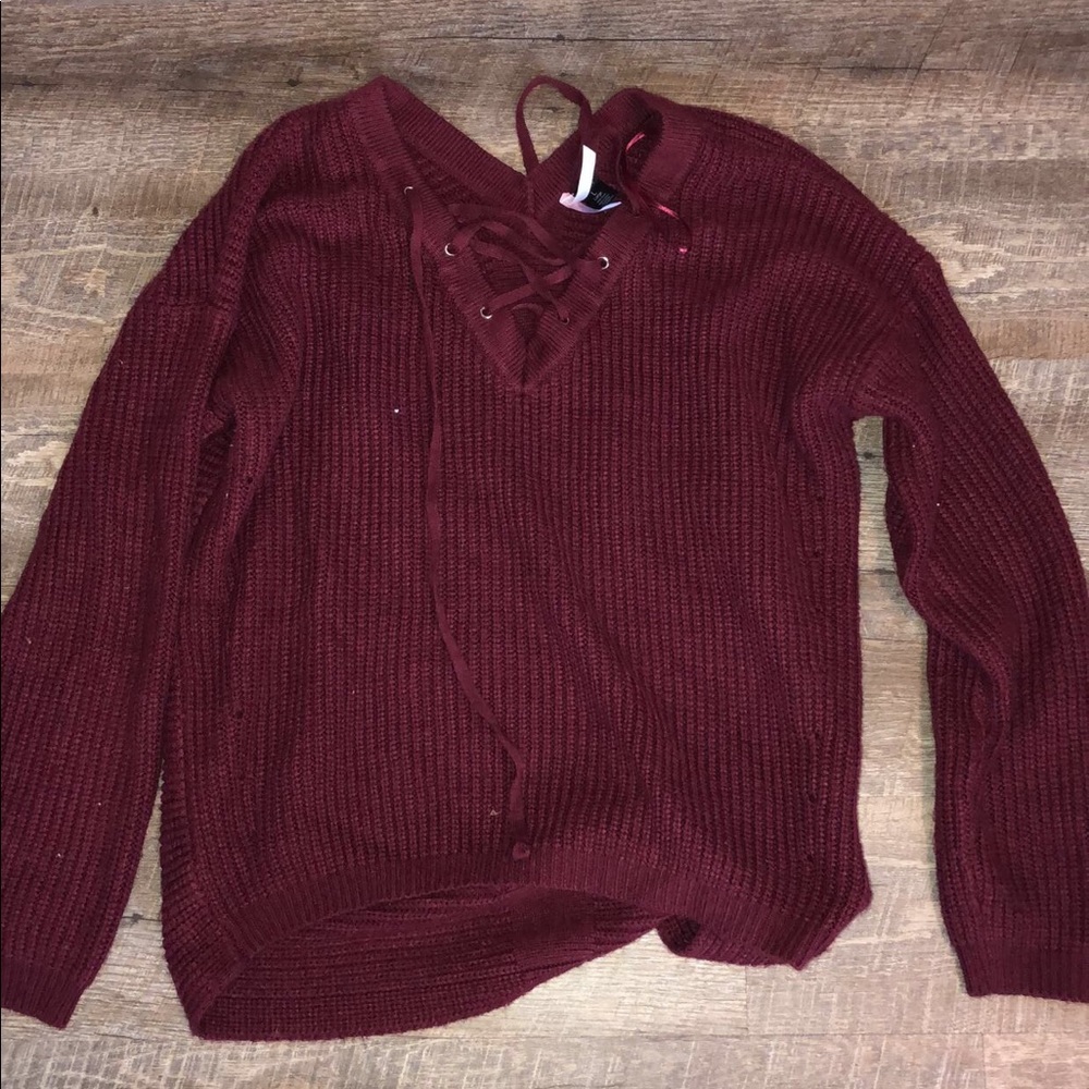A maroon sweater.